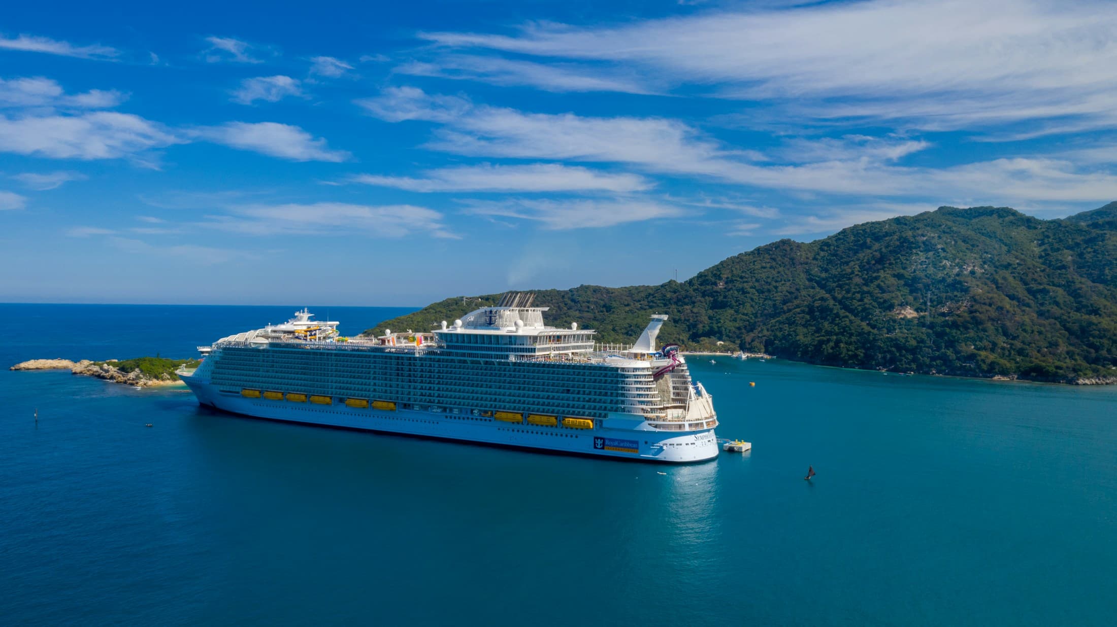 Royal Caribbean cruise ship in a tropical harbor